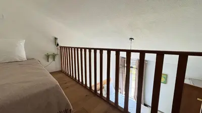 Un ou plusieurs lits dans un hébergement de l'établissement Les Chambres de Giottani