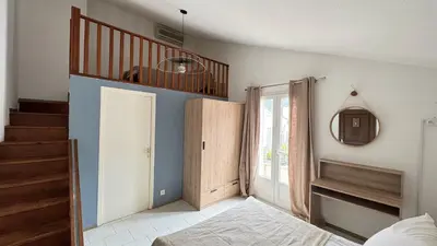 Un ou plusieurs lits dans un hébergement de l'établissement Les Chambres de Giottani