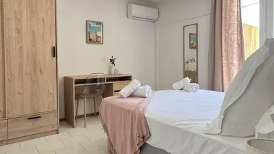 Un ou plusieurs lits dans un hébergement de l'établissement Les Chambres de Giottani