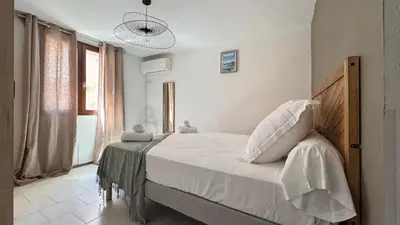 Un ou plusieurs lits dans un hébergement de l'établissement Les Chambres de Giottani