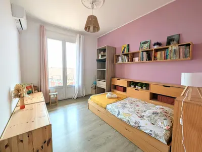 Un ou plusieurs lits dans un hébergement de l'établissement Appartement familial - Vue mer