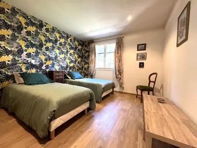 Un ou plusieurs lits dans un hébergement de l'établissement FURIANI Appartement avec Piscine dans Villa