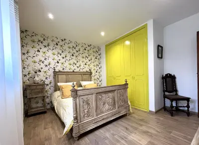Un ou plusieurs lits dans un hébergement de l'établissement FURIANI Appartement avec Piscine dans Villa