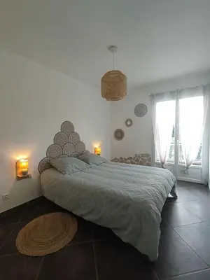 Un ou plusieurs lits dans un hébergement de l'établissement Jolie location chez Philippe & Karine