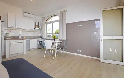 Cuisine ou kitchenette dans l'établissement Appartement Residence Piscine