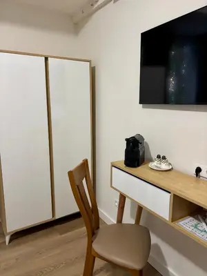 Télévision ou salle de divertissement dans l'établissement Maison Bonaparte