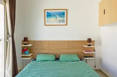 Un ou plusieurs lits dans un hébergement de l'établissement Casa Ange - Appartement vue mer