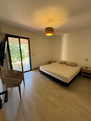 Un ou plusieurs lits dans un hébergement de l'établissement Maison proche des plages