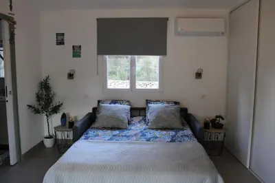 Un ou plusieurs lits dans un hébergement de l'établissement Studio Villa Boca