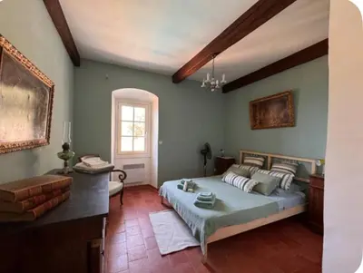 Un ou plusieurs lits dans un hébergement de l'établissement Maison de village atypique A Cappella