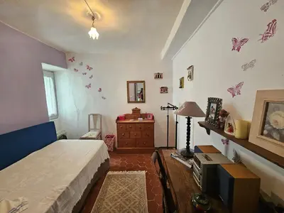 Un ou plusieurs lits dans un hébergement de l'établissement Jolie maison de village- Cap Corse Pietracorbara