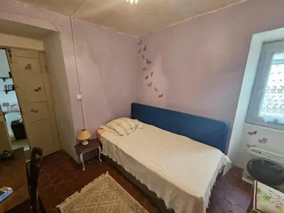 Un ou plusieurs lits dans un hébergement de l'établissement Jolie maison de village- Cap Corse Pietracorbara