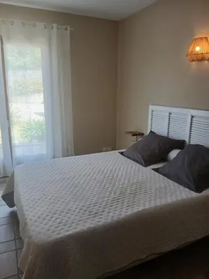 Un ou plusieurs lits dans un hébergement de l'établissement joli appartement lumio