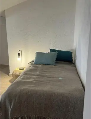Un ou plusieurs lits dans un hébergement de l'établissement Apartment in Ile Rousse with sea view