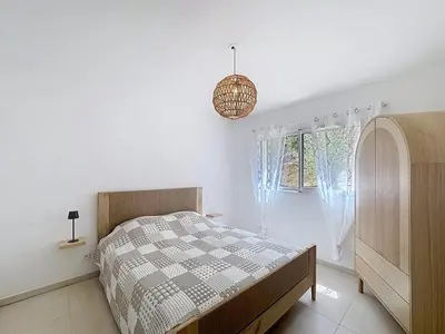 Un ou plusieurs lits dans un hébergement de l'établissement Appartement avec vue sur la mer et la citadelle