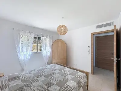 Un ou plusieurs lits dans un hébergement de l'établissement Appartement avec vue sur la mer et la citadelle