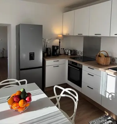 Cuisine ou kitchenette dans l'établissement La demeure des vignes