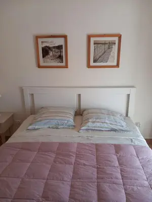 Un ou plusieurs lits dans un hébergement de l'établissement Chez Rachel chambre et salle bain privative chez l'habitant