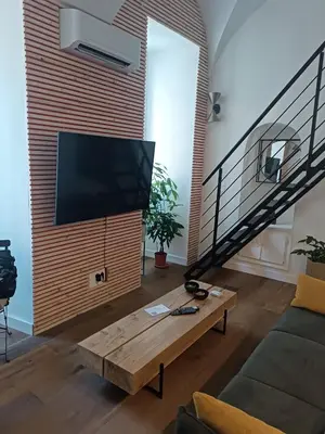 Télévision ou salle de divertissement dans l'établissement Nid douillet - maison Spinola