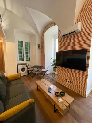 Télévision ou salle de divertissement dans l'établissement Nid douillet - maison Spinola