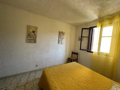 Un ou plusieurs lits dans un hébergement de l'établissement Appartement confortable à Marignana, 50 m² avec 3 chambres