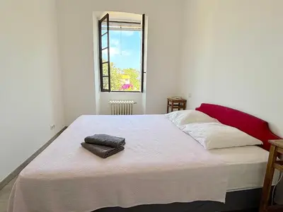 Un ou plusieurs lits dans un hébergement de l'établissement L'appartement Pianosa