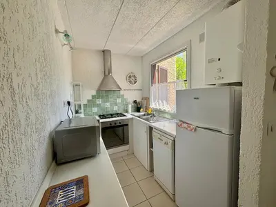 Cuisine ou kitchenette dans l'établissement Appartement T3 Solane 31 LUMIO