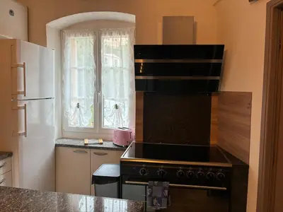 Cuisine ou kitchenette dans l'établissement Appartement Spacieux Vue Montagne- Parking gratuit- Proche ÎLE ROUSSE