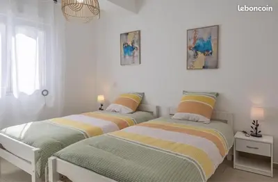 Un ou plusieurs lits dans un hébergement de l'établissement Appartement Lucciana Corse plage à 2 minutes
