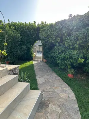 Jardin de l'établissement Appartement A madonna - 900m de la plage