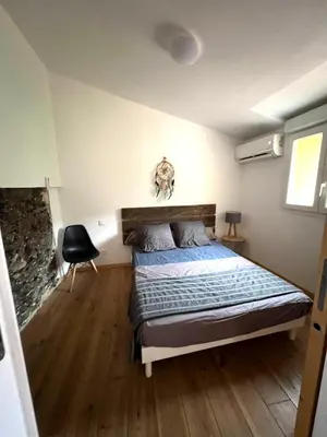 Un ou plusieurs lits dans un hébergement de l'établissement Maison de village