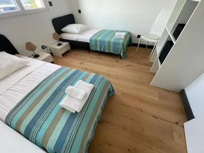 Un ou plusieurs lits dans un hébergement de l'établissement Villa de luxe Piscine 5 chambre