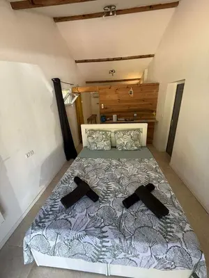 Un ou plusieurs lits dans un hébergement de l'établissement Chambre d'Hôtes Chez Tania et Benoit
