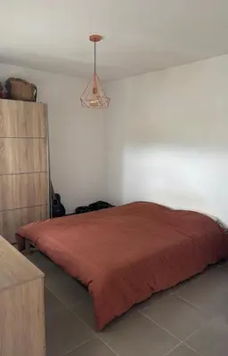 Un ou plusieurs lits dans un hébergement de l'établissement Location de vacances