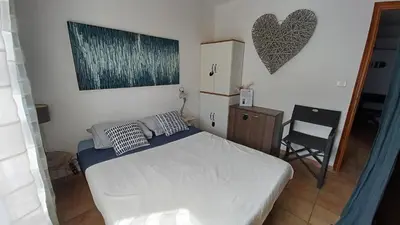 Un ou plusieurs lits dans un hébergement de l'établissement APPARTEMENT ILE ROUSSE VUE MER 5mn PLAGE