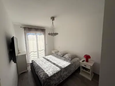 Un ou plusieurs lits dans un hébergement de l'établissement Confortable T3 10 min plage