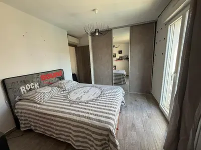 Un ou plusieurs lits dans un hébergement de l'établissement Confortable T3 10 min plage