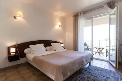 Un ou plusieurs lits dans un hébergement de l'établissement Hotel-Restaurant Le Vieux Moulin