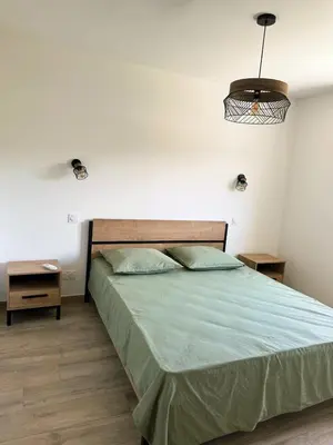 Un ou plusieurs lits dans un hébergement de l'établissement Logement indépendant avec piscine privée