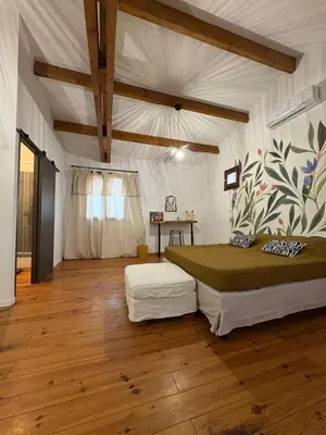 Un ou plusieurs lits dans un hébergement de l'établissement Ferme auberge U sapè fà