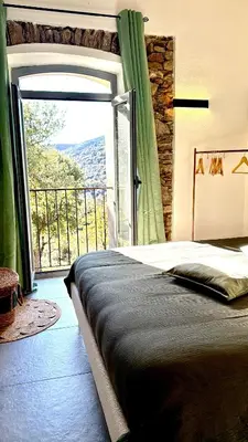 Un ou plusieurs lits dans un hébergement de l'établissement Demeure de charme, appartement du Campu di l altru mondu