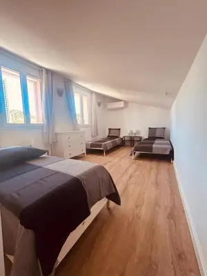 Un ou plusieurs lits dans un hébergement de l'établissement Villa Poggiole
