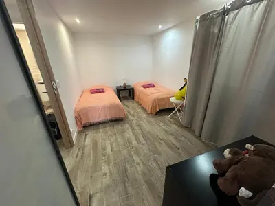 Un ou plusieurs lits dans un hébergement de l'établissement Appartement proche de la rivière et de la plage !
