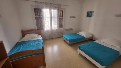 Un ou plusieurs lits dans un hébergement de l'établissement Grand appartement Vescovato entre mer et montagne