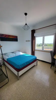 Un ou plusieurs lits dans un hébergement de l'établissement Grand appartement Vescovato entre mer et montagne