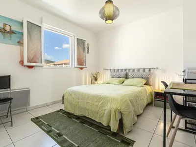 Un ou plusieurs lits dans un hébergement de l'établissement Apartment Albarella by Interhome