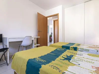 Un ou plusieurs lits dans un hébergement de l'établissement Apartment Albarella by Interhome