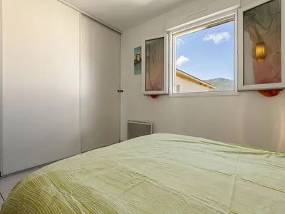 Un ou plusieurs lits dans un hébergement de l'établissement Apartment Albarella by Interhome