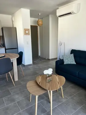 Coin salon dans l'établissement Appartement T2 neuf résidence U Scalu