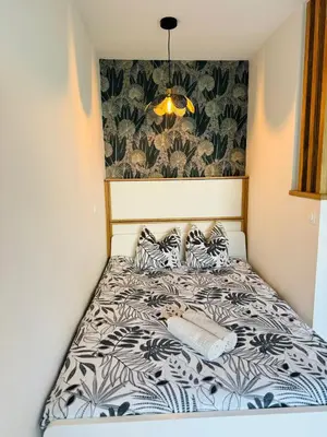 Un ou plusieurs lits dans un hébergement de l'établissement Appartement vue Citadelle